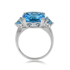 A gemstone and gold ring featuring an 8.70-carat cushion cut topaz, set in double prongs. Pear-shaped topaz weighing approximately 0.10 carats each are set in prongs on the shoulders. A single-cut diamond is set into each side of the shank underneath the pear shape accent stones. The under-gallery displays open work. This ring is handcrafted in 18k white gold.
The measurements of the center stone are approximately 11.86mm x 11.99mm x 6.56mm.
This ring can be resized to any finger size at no extra cost.
If you have any questions about the Selden ring, please feel free to contact us. Estate Diamond Jewelry, Topaz Stone, Perfect Engagement Ring, Unique Engagement Rings, Cushion Cut, Pear Shape, Pear Shaped, Gold Ring, Diamond Jewelry