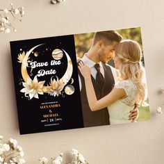 a wedding photo save the date card with flowers on it and a couple kissing each other