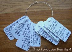 four tags with writing on them are hanging from a keychain that says, the ferguson family