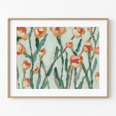 an art print with flowers on it in a wooden frame hanging on a white wall