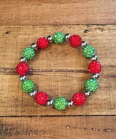 "This listing is for one bracelet. Choose either gold or silver spacer beads.  This is a beautiful red and lime green Shamballa bracelet. It is just gorgeous! If you like bling, this bracelet has it. It is made from clay and rhinestone shamballa beads with gold (brass) or silver (stainless steel) accent beads.  It is elastic for the perfect fit and easy to put on. It is 7\" long. This is a bracelet you will love to wear!" Holiday Beaded Jewelry, Winter Bracelet, Silver Outfits, Holiday Beading, Green Bracelet, Diy Jewelry Inspiration, Bubble Necklaces, Diy Bracelet Designs, Beadable Products