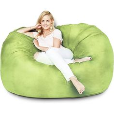 a woman sitting on a bean bag chair