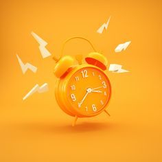 an orange alarm clock with white arrows coming out of it on a yellow and orange background