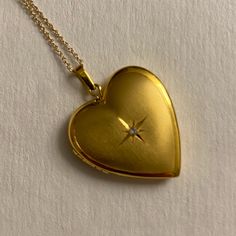 This Is Like New From Macys. A Solitary Diamond Accent Brings The Right Amount Of Sparkle To This Elegant Heart Locket Pendant Necklace Set In 10k Gold To Spring Ring Clasp. Diamond Star On One Side, Ribbed Texture On The Other. Approximate Length: 18". Approximate Drop: 1". Retails For $650, Asking $500. Dreamy Jewelry, Gold Dainty Necklace, Gift Aesthetic, Gold Heart Locket, Vintage Locket, Macys Jewelry, Gold Heart Pendant, Locket Pendant Necklace, Heart Locket Necklace