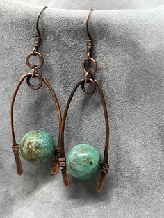 handmade earrings featuring jasper in a teal color with copper settings, unique and beautiful Copper Dangle Earrings With Patina, Copper Dangle Jewelry With Patina, Bronze Wire Wrapped Drop Earrings, Nickel Free Jasper Bohemian Jewelry, Nickel-free Bohemian Jasper Jewelry, Bohemian Jasper Jewelry Nickel Free, Copper Jewelry With Matching Round Bead Earrings, Artisan Copper Wire Drop Earrings, Earthy Nickel-free Copper Jewelry