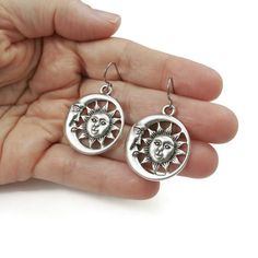 Free shipping Canada & USA with $35 purchase. Unique sun and moon celestial statement earrings. - Assembled with pure titanium ear wires (G1). Titanium is 100% hypoallergenic and will not produce skin irritation or discoloration. - Tibetan style alloy pendant measuring 30 x 26mm (cadmium free, nickel free & lead free) - Silicone stoppers included. Moon And Sun, Gem Shop, Titanium Earrings, Titanium Jewelry, Celestial Jewelry, Skin Irritation, Earrings Unique, Moon Earrings, Sun And Moon