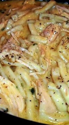 pasta with chicken and parmesan cheese in a skillet