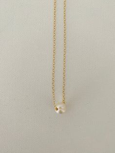 Just A Pearl! This simple yet elegant necklace is part of my Just A Pearl collection. One single pearl dangles from a delicate gold necklace. It measures 16 inches and length and can be adjusted to 15 inches for choker length. Dainty Gold Chain, Delicate Gold Necklace, Single Pearl, Choker Style Necklace, Classic Necklace, Pearl Collection, Elegant Necklace, Necklace Pearl, Choker Style