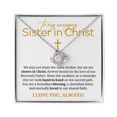 a necklace with the words to my amazing sister in christ on it and an image of a