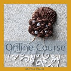 a close up of a yarn ball on top of a piece of cloth with the words online course written below it