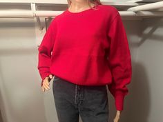 "Warm crewneck pullover for those cool fall and winter days.  Relaxed body and snug in the wrists and waist. A couple of spots on sleeve and waist, with some faint discoloration on the front, however flaws are minimal. Best for XS/S For reference, mannequin measurements are as follows: Height: 69\" (5'9\") Chest: 32\" Waist: 24\" Hip: 34\" All measurements of items listed are approximate, and are taken as accurately as I can to the best of my ability. Please note that with vintage items, there may be signs of wear and small imperfections. When possible, we will show imperfections and the price will reflect these. If you have any questions, or would like to see more pictures, please don't hesitate to reach out." Vintage Solid Sweater With Ribbed Cuffs, Vintage Long Sleeve Stretch Sweater, Vintage Solid Sweater For Fall, Vintage Solid Color Sweater For Fall, Vintage Sweater For Fall, Solid Vintage Sweater For Fall, Vintage Stretch Sweater For Winter, Red Crewneck, Kansas City Mo