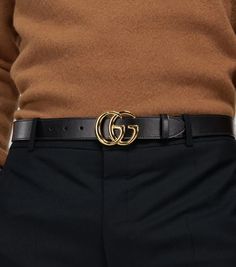 Crafted in Italy from smooth leather, this black belt from Gucci features the label's GG logo on a gold-toned buckle..Closure: push-stud fastening tab.Color of fastening: gold.Made in Italy.Material: calf leather.Width 3cm-1' Formal Black Belt With Metal Logo, Black Belt With Metal Logo, Designer Belts With Gold-tone Hardware For Business, Designer Business Belts With Gold-tone Hardware, Classic Black Belt With Metal Logo, Modern Business Belt Buckles With Metal Logo, Black Belt Buckles With Gold-tone Hardware For Business, Leather Belt With Gold-tone Logo For Business, Designer Belts With Metal Logo For Business