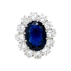 This 18K white gold refine ring is from our Timeless Collection. It is made of a 4.80 Carat gorgeous siam blue sapphire decorated by 12 round shape natural white diamonds in total of 2.48 Carat. Total metal weight is 6.5 gr. Extraordinary piece for any occasion and over the generations ! The Timeless Collection is from the passion and love of Maison Vitale, inspired by the endless elegance and sophistication of classic high-jewelry, eternizing its beauty and presenting a selection of classy desi Luxury Cluster Sapphire Ring Gia Certified, Luxury Gia Certified Cluster Sapphire Ring, Luxury Sapphire Cluster Ring With Brilliant Cut, Luxury Sapphire Diamond Ring With 17 Jewels, Gia-certified Cluster Sapphire Ring With Diamond, Gia Certified Cluster Sapphire Ring With Diamond, Luxury Sapphire Birthstone Ring For Formal Occasions, Gia Certified Cluster Sapphire Ring, Formal Vvs Clarity Cluster Sapphire Ring