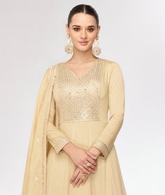 COLOR : Dull Yellow Cream FABRIC : Gown & Dupatta - Premium Silk WORK : Resham Embroidery, Hand Work, Sequins, Floral Motifs, Lace Border OCCASION : Wedding, Reception, Mehendi, Party Wear, Festival READY-TO-WEAR : No STITCHING : Available as semi-stitched fabric, can be stitched using standard size option (+$30). Note: There might be a slight color variation due to lighting and flash used during photoshoot. The bright shade seen is the best closer view of fabric's color. Silk Anarkali Gown, Silk Anarkali, Gown Party Wear, Party Wear Gown, Anarkali Gown, Yellow Cream, Lace Border, Formal Occasion, Anarkali