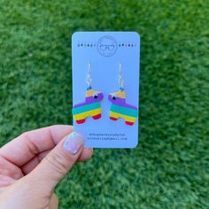 You wear the party on your ears with our Burro Piñata Dangle Earrings and Studs.  Our pinata earrings would make a great one of a kind gift, or a cute addition to an outfit.   Each earring is handmade and completely unique. If you're interested, you can see my process from beginning to end on my Tiktok @sirenamaxx. My earrings are made of 1/8 of an inch thick light weight polymer clay and are finished with a surgical steel, nickel-free ear wire and ear posts. Dangle Earrings hang 1 inch from ear Novelty Multicolor Dangle Jewelry, Multicolor Novelty Dangle Jewelry, Nickel-free Multicolor Novelty Jewelry, Novelty Multicolor Earrings For Birthday, Nickel-free Multicolor Earrings For Birthday, Novelty Multicolor Earrings With Ear Wire, Rainbow Colorful Earrings For Gift, Fun Multicolor Jewelry For Crafting, Playful Multicolor Earrings For Birthday