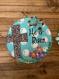 18 inch round Easter HE IS RISEN door hanger! Perfect for Easter time on your front door or hanging on your wall. Painting Galvanized Metal, Spring Porch Decor, Birthday Wreath, Easter Buckets, Round Door Hanger, Llama Birthday, Staff Gifts, Wood Door Hangers, Easter Season