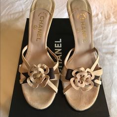 Chanel Open Toe Suede Mules With Chanel Flower And Ribbon Luxury Cream Heels For Spring, Luxury Beige Heels For Spring, Luxury Beige Spring Heels, Luxury Suede Sandals For Spring, Luxury Almond Toe Heels For Spring, Designer Suede Heels For Spring, Mules Chanel, Vintage Mules, Chanel Mules