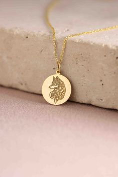 Gold Wolf Pendant - howling Gold Necklace ● Material of pendant: Solid Gold 14k ( REAL GOLD ) ● Metal Stamp: 14k ( REAL GOLD ) ● The pendant is available in 5 sizes: - 12,7 mm / 0.5 inches (Diameter) - 14,0 mm / 0,55 inches ( Diameter ) In the photos - 15,3 mm / 0.6 inches ( Diameter ) - 16,5 mm / 0,65 inches ( Diameter ) - 19,1 mm / 0,75 inches ( Diameter ) ( In the photos the size is 14mm / 0.55 inches Diameter ) ( Jump Ring inner diameter: 4 mm ) ● Material of chain: Solid gold 14k ( REAL GOL Round Wolf Design Jewelry Gift, Wolf Design Round Jewelry Gift, Sterling Silver Necklace With Wolf Design As Gift, Sterling Silver Wolf Design Necklace As Gift, Sterling Silver Necklace With Wolf Design For Gift, Men Wolf Necklace, Wooden Wolf Pendant, Nordic Wolf Necklace, Wolf Pendant Necklace