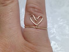 Big wire wrapped heart shape ringComes in Silver plated nickel free, Gold or light pink artistic wireall are tarnish resistant Adjustable wire ring. Please specify ring size at checkout. Price is for one ring. They are formed freehand by me and each one is unique and individualized. Packaged with care and comes in a gift box. Please note that if more than one ring is ordered they will be in the same box to save on postage.  Questions? Please let me know.Thanks for looking,Jane Valentine's Day Adjustable Wire Wrapped Jewelry, Unique Adjustable Heart-shaped Ring, Unique Adjustable Heart Ring, Unique Adjustable Heart Shaped Ring, Handmade Gold Heart Ring For Promise, Adjustable Handmade Gold Heart Ring, Dainty Handmade Adjustable Heart Ring, Handmade Minimalist Heart Ring, Minimalist Handmade Heart-shaped Ring