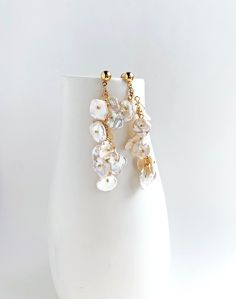 The pearls in this earring remind me of flower petals. Each keshi pearl has a unique shape that lends to the natural shape of petals. This earring is for the romantic at heart.  + Pearls. 14K Gold Fill Post Earring. + Length: 2.75 inch. + Earrings take 1 business day to make. + Your jewelry will come in a jewelry box, tied with a ribbon. ➤➤ Have a question about this product, reach out to me here ➙ https://www.etsy.com/conversations/new?with_id=9057464&referring_id=5772224&referring_type=shop&re Party Pearl Drop Earrings Made Of Mother Of Pearl, Elegant Flower Earrings With Dangling Beads, Floral Pearl Charm Earrings For Wedding, Long Drop Pearl Earrings With Dangling Beads For Wedding, Pearl White Dangling Beads Earrings For Wedding, Elegant Flower Earrings With Dangling Beads For Wedding, Pearl White Pearl Earrings With Dangling Beads For Wedding, Elegant Gold Flower Earrings With Dangling Beads, Wedding Long Drop Pearl Earrings With Dangling Beads