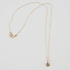 Keep it simple with the DELIA Tiny Flower Pendant Necklace. Small but with a lot of style, accentuate your look with its distinguished elegance. It grabs the attention not just by its shape but also by its charming 14K gold color. This necklace gives you all the reasons to make it a pick of the day. Features: Comfortable Lightweight Elegant and minimal High quality Hand-carved flower-shaped pendant Size & Material: Length: 17" inches Material: 14K gold chain and pendant with an inset of a diamon Everyday 14k Gold Necklaces With Flower Charm, Everyday 14k Gold Necklace With Flower Charm, Elegant Gold Plated Round Birthstone Necklace, Elegant 14k Gold Jewelry With Flower Charm, Classic Gold Jewelry With Flower Charm, Delicate Gold Diamond Necklace With Single Cut Diamonds, Delicate Diamond Necklace With Flower Charm, Delicate Gold Plated Diamond Necklace With Delicate Chain, Elegant Gold Flower Pendant Necklace