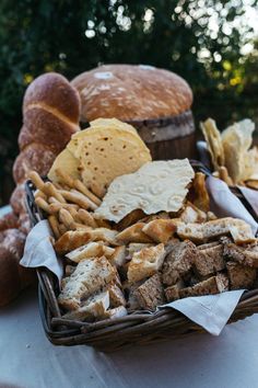 bread and crackers in a basket on a table