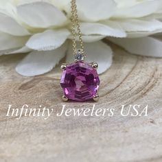 "The pendant pictured is lab created pink sapphire #6673. -Approximate total carat weight: 2.75ctw diamond equivalent -Stone Size: 9mm approx. 2.70ct diamond equivalent -Stone Shape: octagon/web cut -Gem Type: lab created pink sapphire -Stone Color: Pink -Stone Clarity: VS2 -Moh's Scale: 9 hardness Accent Stone -Stone Size: approx. .03ctw -Stone Shape: round -Gem Type: Diamond -Stone Color: G -Stone Clarity: SI1 -Moh's Scale: 10 hardness -Metal Type and Purity: 14k yellow gold -Setting: basket h Pink Necklace With Diamond Accents Gift, Pink Necklaces With Diamond Accents For Gift, Fine Jewelry Pink Sapphire Round Cut, Oval Pink Sapphire Jewelry With Diamond Accents, Pink Ruby Necklace Fine Jewelry, Formal Pink Pendant Jewelry, Dazzling Pink Sapphire Round Cut Jewelry, Dazzling Oval Pink Sapphire Jewelry, Rose Gold Jewelry With Pink Sapphire Gemstone