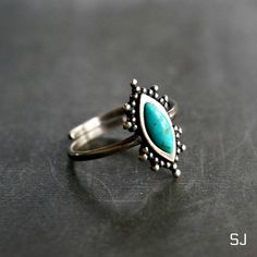 This fine sterling silver ring features natural turquoise. Adjustable ring band allows you to wear it on any finger or stack with others. 100% Solid 925 sterling silver Authentic turquoise from Arizona, USA. Handcrafted Size: adjustable band, fits all sizes * By Sowell Jewelry Official site: www.sowelljewelry.com SUBSTANTIAL PACKAGING: To ensure our packaging is as eco-friendly as possible, we only use recyclable materials such as paper and cardboard. Adjustable Bohemian Turquoise Promise Ring, Bohemian Adjustable Emerald Open Ring, Bohemian Emerald Adjustable Open Ring, Adjustable Silver Turquoise Ring With Spiritual Style, Bohemian Stackable Turquoise Ring, Bohemian Adjustable Turquoise Stackable Rings, Bohemian Turquoise Open Ring For Promise, Bohemian Turquoise Open Promise Ring, Bohemian Open Turquoise Promise Ring