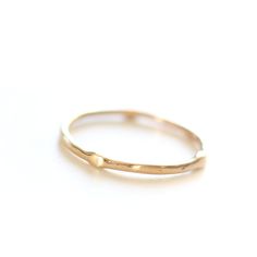 Introducing the original Dainty Ring - a must-have for every ring stack! Made from 14k yellow gold, this ring is both delicate and chic. Wear it alone for a minimalist look or stack it up to create a personalized set. Handcrafted with care, each ring is unique, showcasing its own rustic character. Measuring 1mm in width, this ring is the perfect addition to your jewelry collection. • Please note that Amy will need two weeks to create your ring with utmost attention to detail. Minimalist 14k Rose Gold Solitaire Jewelry, Minimalist 14k Rose Gold Ring, Delicate Stackable 14k Rose Gold Rings, Everyday Stackable Diamond Ring With Round Band, Minimalist 14k Rose Gold Promise Ring, Simple Stackable Open Band Rings, Everyday Yellow Gold Diamond Ring With Si Clarity, Everyday Yellow Gold Diamond Ring Si Clarity, Delicate 14k Rose Gold Stackable Rings