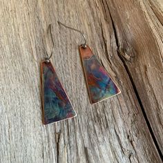 These little beauties are so easy to throw on and wear for work or play.  The multicolor pattern make them versatile to wear with so many outfits.  Each pair are a one of a kind and hang from stainless steel ear wires.  I use the heat of my torch to create each pattern and colors on each earring.  I use a protective coating to preserve their beauty.  Note: Each pair have their own unique colors and patterns. Multicolor Copper Jewelry For Gifts, Multicolor Copper Jewelry For Gift, Multicolor Copper Jewelry Gift, Handmade Rainbow Earrings For Everyday, Handmade Rainbow Earrings For Everyday Wear, Artsy Nickel-free Copper Earrings, Artsy Brown Earrings With Ear Wire, Artsy Pierced Copper Earrings, Artistic Multicolor Copper Jewelry