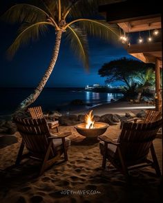 two chairs sitting in front of a fire pit on top of a sandy beach next to the ocean