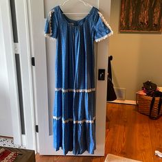 1970’s With Original Price Tags Vintage Hilda Hawaii Maxi Dress. Never Worn. Vintage Size 12, Would Fit A Generous Medium. Pit To Pit 19”. Has Pockets And Is Flawless. Split Lace Trim Short Sleeves. Blue And Pink Calico With White Lace Trim. A True Beautiful Piece! Vintage Blue Maxi Dress For Vacation, Vintage Blue Midi Length Maxi Dress, Vintage Short Sleeve Midi Dress For Vacation, Blue Lace Trim Maxi Dress For Daywear, Blue Maxi Dress With Lace Trim For Daywear, Blue Lace Trim Vintage Summer Dress, Vintage Short Sleeve Dresses For Vacation, Blue Vintage Dress With Lace Trim For Summer, Vintage Blue Prairie Dress For Summer