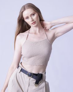 Flaunt your svelte silhouette with this ravishing spaghetti-strap cami crop top, offering a striking crisscrossed and backless design. Boasting a high-stretch, 97% polyester and 3% spandex raschel fabric construction, its slim fit silhouette lends an undeniably sexy allure. For lasting quality, simply machine-wash or professionally dry-clean. Chic Crop Top With Built-in Bra And Strappy Back, Casual Crop Top With Built-in Bra And Strappy Back, Trendy Beige Crop Top With Built-in Bra, Chic Stretch Crop Top With Strappy Back, Chic Tank Top With Adjustable Straps And Strappy Back, Trendy Solid Halter Top With Built-in Bra, Trendy Cropped Halter Top With Built-in Bra, Trendy Cropped Camisole With Straps, Fitted Strappy Back Crop Top