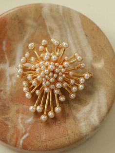 Introducing our Vintage Fashion Pearl Firework Brooches - a charming and stylish accessory, they offer a gorgeous and luxurious look thanks to their unique vintage inspired design. Perfect for both casual and formal attire, these brooches display vintage-inspired fashion and timeless elegance. Metal: 18K Recycled Gold Plated On Brass Gemstone:Imported artificial pearls Dimensions:45*50mm Weight: 26.5g Brooch Display, Vintage Inspired Fashion, Inspired Fashion, Vintage Inspired Design, Recycled Gold, Formal Attire, Stylish Accessories, Retro Inspired, Fireworks