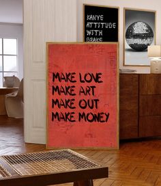 there is a sign that says make love art make out make money on the wall