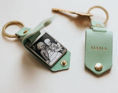 a keychain with a photo on it and a couple's name tag attached to it