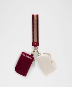 two lanyards attached to each other on a white surface with a red tag