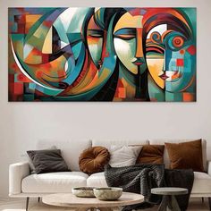 an abstract painting on the wall above a couch in a living room with white furniture