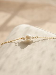 If you are interested in placing a bulk order (50+ pieces), please message us for special pricing.-- 925 silver pearl bracelet, dainty gold bracelet, delicate pearl bracelet, bridesmaid bracelets-- ► DETAILS  -925 sterling silver + 14k gold -Freshwater pearls -Length: 6 inches + 2 inches chain extender ►Heavenly Materials Our jewellery pieces are delicately handcrafted with gold-fill, sterling silver, stainless steel and gold-plating, combining rich, warm tones with an effortless shine.  ►Prompt Bridesmaid Bracelets, Silver Pearl Bracelet, Gold Pearl Bracelet, Dainty Gold Bracelet, Gold Armband, Bracelet Dainty, Bridesmaid Bracelet, Chain Extenders, Bracelet Sterling Silver