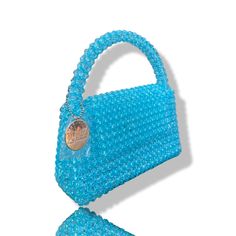 Artisan Beaded Handbag.Designed in NYC. Crafted with precision in the heart of Lagos, Nigeria.Elevate your style with our exquisite beaded handbags – a timeless accessory that seamlessly blends sophistication with versatility. Meticulously handcrafted, these bags are built to withstand the test of time. Whether paired with a cocktail dress, jeans and a tee, professional attire, or your favorite clubwear, our bead bags effortlessly complement any ensemble. Formal Beaded Shoulder Bag With Top Handle, Formal Beaded Top Handle Shoulder Bag, Luxury Beaded Rectangular Clutch, Luxury Handheld Beaded Shoulder Bag, Luxury Handheld Beaded Evening Bag, Luxury Beaded Handheld Evening Bag, Luxury Beaded Shoulder Bag For Fashion, Elegant Handmade Bags With Round Handle, Handheld Beaded Clutch