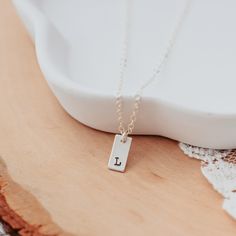 Initial Tiny Rectangle Tag Necklace-Rockaway Gypsea Minimalist Hand Stamped Initial Necklace, Dainty Stamped Charm Necklaces For Everyday, Minimalist Hand Stamped Initial Necklace For Everyday, Minimalist Everyday Hand Stamped Initial Necklace, Simple Personalized Charm Necklace As Gift For Her, Minimalist Rectangular Necklaces As Gift For Her, Minimalist Rectangular Necklace As Gift For Her, Everyday Personalized Square Pendant Charm Necklaces, Dainty Hand Stamped Initial Necklace For Everyday