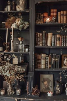 an old bookcase filled with lots of books and vases on top of it