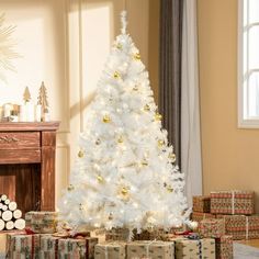 a white christmas tree surrounded by presents