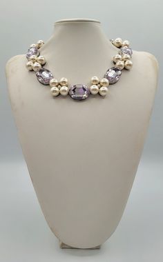 Each piece of our statement necklaces is handmade and one of a kind made in Italy. Our creations is made of high quality materials such as crystals and rhinestones. Each embroidered material is carefully hand sewn. Very glamorous and stylish. Perfect gift to someone you like. Materials Strass stones in  Violet color and White pearls.  Black eco leather backing. Aluminium color hook closure. Measurements Weight approximate 150 grams. Circumference approximate 59 cm - 23,22 in Feel free to contact us if you have any question. Thank you so much for looking at our shop and our articles each of them, single piece. Elegant Beaded Rhinestone Necklace As Gift, Elegant Beaded Rhinestone Necklace For Gifts, Pearl Necklaces With Rhinestones For Gift, Elegant Crystal Beaded Necklaces With Stones, Unique Pearl Necklaces For Party, Elegant Handmade Crystal Rhinestone Necklace, Handmade Elegant Crystal Rhinestone Necklace, Pearl Jeweled Necklaces For Gifts, Pearl Jeweled Necklaces As Gift