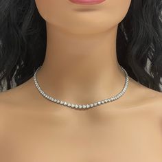 A classic and elegant everyday or occasional wear the Beauvince Adjustable Length Cupcake Tennis Necklace is a timeless and versatile piece of jewelry. It can we worn at any length between 13 inches 30 inches ranging from a choker to a long layer. Total Diamond Weight: 7.18 ct Diamond Color: G - H Diamond Clarity: SI - I (Slightly Included - Included) Metal: 14K White GoldMetal Weight: 18.35 gms Setting: Prong Set Length: 13 - 30 inches Classic Tennis Choker Necklace For Formal Occasions, Classic Formal Tennis Choker Necklace, Timeless Single Strand Diamond White Jewelry, Dazzling Single Strand Round Cut Jewelry, Silver Single Strand Tennis Necklace, Classic Tennis Necklace With Diamond Accents As A Gift, Classic Formal Diamond Choker Necklace, Formal Bridal Necklace With 17 Jewels, Timeless Silver Single Strand Tennis Necklace