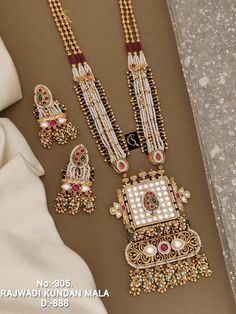 Description :- Antique Gold-Plated Indian Jewelry Set with Long Necklace and Earrings | South Indian Temple Jewelry Set | Gift For Her Gift yourself a royal look with this perfectly crafted kundan necklace set from Manalisstudio. Crafted with high quality kundan stones and pearls, it is impressive in design. The green enamel artwork adds perfect texture to the design. Perfect for weddings and festivities, this antique necklace set should be put on with your favorite sari or lehenga. 100% Satisfa Luxury Festive Temple Necklace With Stone Work, Luxury Temple Necklace With Zari Work For Gift, Long Sets Gold Jewellery, Indian Long Necklace, Kundan Long Necklace, South Indian Temple, Indian Jewelry Set, Temple Jewelry Necklace, Jewelry Kundan