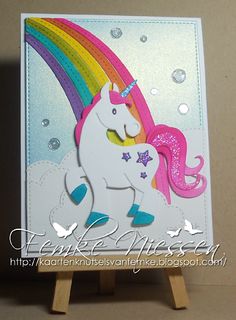 a card with a unicorn and rainbow on it