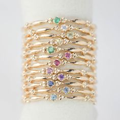 This dainty birthstone stackable ring is unlike any other, the band has a unique design all around which gives a bit of antique feel. Perfect gift for July birthdays! * Stock size: US 7 * Genuine 1.5mm garnet * Band width: ≈1.75mm * Setting size: ≈2mm * Material: 14k solid yellow gold (rose gold or white gold option available) * Made of 100% recycled precious metal and ethically sourced gemstone * Comes in a gift box with a bow ready for gifting * Handmade with love and great care in New York &l Gold Stackable Rings With Gemstone Accents, Dainty Stackable Emerald Ring, Stackable May Birthstone Ring In Fine Jewelry Style, May Birthstone Stackable Fine Jewelry Ring, May Birthstone Stackable Ring In Fine Jewelry Style, May Birthstone Yellow Gold Stackable Rings, Fine Jewelry Yellow Gold Stackable Rings For May Birthstone, Dainty 14k Gold Filled Stackable Rings For Anniversary, 14k Gold Stackable Rings For Anniversary, May Birthstone