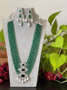 Gorgeous Victorian theme Green beads with white Rhodium/ Silver finished statement Necklace with matching earrings traditional set that goes well with your traditional outfits. This haram's measurements are given in one of the pictures.  Please take a look before you order! Measurements of the earrings: Height of earrings: 7.7 Cm  Width of earrings: 3 Cm  We tried our best to picture the item as close to original as possible. But please be aware of minor variations in shade due to digital pictur Traditional White Jewelry Sets With Polished Beads, Traditional Polished Beads Earrings For Wedding, Traditional Silver Beaded Bridal Necklace, Silver Beaded Chandbali Bridal Necklace, Traditional Silver Beaded Jewelry Sets, Traditional Silver Jewelry Sets With Round Beads, Traditional Jewelry Sets With Polished Beads For Celebration, Traditional Green Bridal Necklace For Eid, Elegant Green Jewelry For Eid