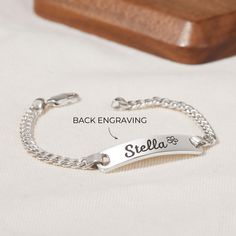 Luxurious Personalized ID Name Bracelet in Silver, Gold, Rose Gold - Durable Stainless Steel with Custom Engraved Charms, Ideal for Mothers, Birthdays, Anniversaries Discover the charm of our Personalized ID Name Bracelet, a bespoke piece of jewelry that celebrates your unique story. Crafted with high-quality stainless steel and available in stunning silver, gold, and rose gold finishes, this bracelet is an epitome of elegance and durability. Each bracelet can be personalized with up to 20 charm Personalized Adjustable Metal Chain Bracelet, Personalized Adjustable Sterling Silver Bracelet, Personalized Metal Chain Bracelet, Silver Metal Name Bracelets, Adjustable Sterling Silver Name Bracelets, Adjustable Silver Jubilee Name Bracelet, Silver Metal Bracelets With Name Detail, Silver Engraved Heart Bracelet, Adjustable, Silver Nameplate Friendship Jewelry